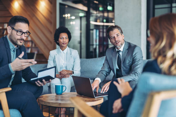 Group of business persons having a meeting
